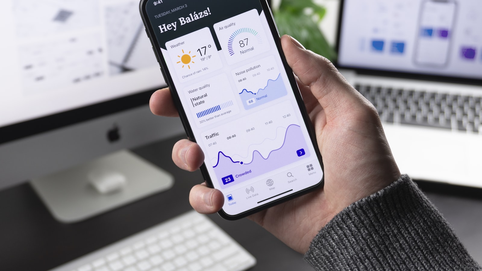 A tidy phone home screen with a few neatly arranged app icons held in one hand